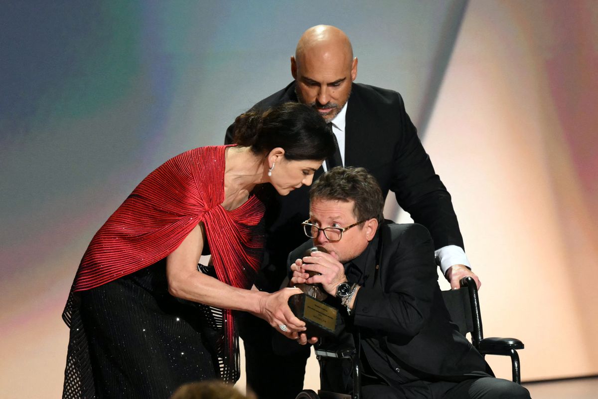 Canadian-US actor Michael J. Fox aaccepts the Bob Hope Humanitarian award from US actress Julianna Margulies during the 78th Primetime Emmy Awards at the Peacock Theatre at LA Live in Los Angeles on September 14, 2026. (Photo by Patrick T. Fallon / AFP) / RESTRICTED TO EDITORIAL USE