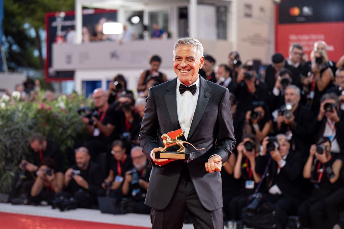 George Clooney poses on the red carpet after receiving the Golden Lion for Lifetime Achievement Award during the opening ceremony of the 83rd Venice International Film Festival at Sala Grande in Venice, Italy, on September 2, 2026. (Photo by Luca Carlino/NurPhoto) (Photo by Luca Carlino / NurPhoto via AFP)