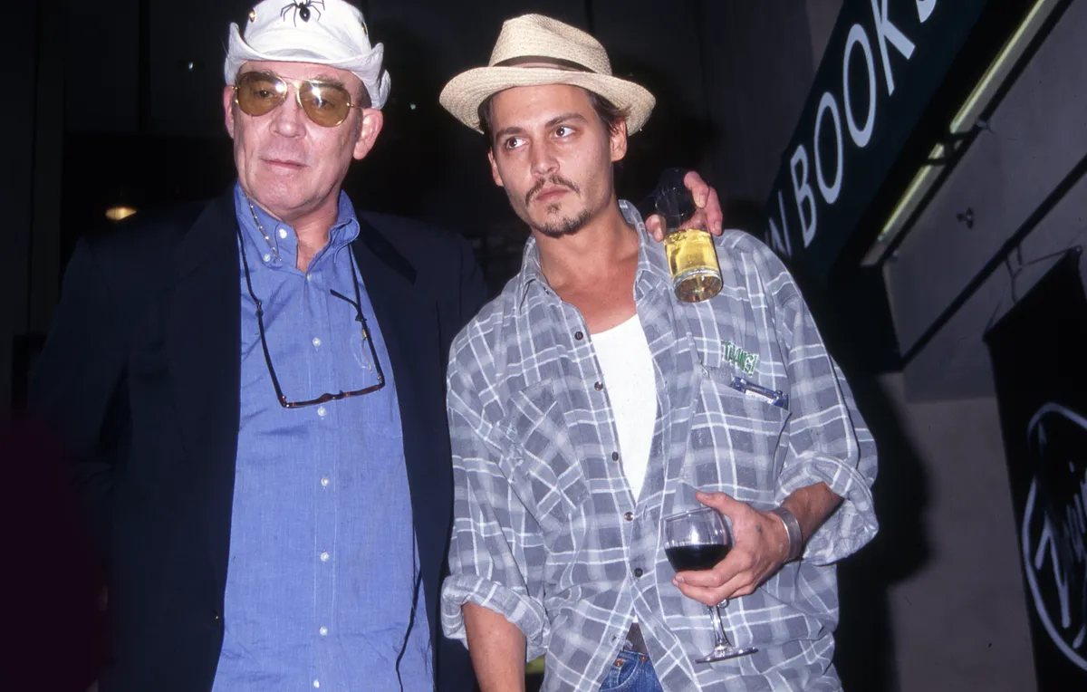 Author Hunter S. Thompson and actor Johnny Depp attend a book signing at Virgin Megastore, New York, 1998. (Photo by Rose Hartman/Getty Images)