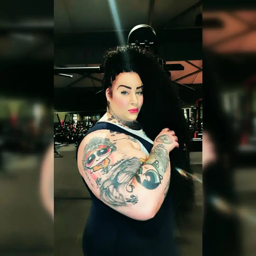 Jackie poses at the gym. SCHAGEN, NETHERLANDS. MEDIA DRUM WORLD
+44 (0) 333 321 1546
www.mediadrumworld.com
picturedesk@mediadrumworld.com
She has Bigger Arms than Arnie
By Aimee Braniff Cree
**EXCLUSIVE**
MEET THE WOMAN who at 24 inches has bigger biceps than Arnie in his prime having dedicating the last two years of her life to bodybuilding and is not afraid to face down the online haters.
Self-proclaimed “She Hulk”, Jackie Koorn (33) a security company owner from Schagen, Netherlands is known as a muscle machine who has always been into fitness and spent much of her youth participating in judo, football, swimming, and kickboxing.
It was not until she had to take a hiatus from kickboxing in 2020 because of COVID restrictions that she began taking body building seriously.
Since then Jackie has more than doubled her body weight she is now a strong 25 stone with 70% of that being pure muscle.
Jackies has biceps of 24 inches, with legendary bodybuilder and actor Arnold Swarzanagger’s biceps measuring 22 inches in his prime, with a 46 inch chest, 53 inch hip and 41 inch quads.
The response Jackie gets from posting her pictures online varies from being called “fat” and “a feminine man” to having proposals of marriage for her perfect body.
None of this hype bothers Jackie though, her focus is always on bettering herself and getting stronger.
“I am one of six children, our family has a background of playing sports. At a young age I was taking part in judo, football and swimming,” said Jackie.
“I come from a good family, we were always taught if you want something you have to work for it. I think that has carried through into my fitness, I work very hard for my body.
“What led me to building my curvy girl muscle was my temporary hiatus from kickboxing, I always had an interest in fitness but having to take a hiatus allowed me to focus on a different way of using my body, that led me here.”
Before taking bodybuilding seriously Jackie was still fit, she weighed 11-and-a-half stone, but the constant dieting this weight required affected her physically.
“Before I got so strong I still felt good, but often tired due to the continuous dieting,” she said.
“Now I feel strong, huge and pretty good. I have built myself up through continuing a good diet and exercise regime. Good food and lifting weights that what you need if you want to grow muscle.
“I’m now cutting so its now so my diet is eight cooked eggs a day, two at breakfast with some cottage cheese and granola, one hour later two cooked eggs again, for lunch it will be two cooked eggs with some chicken breast on a cracker, at dinner I'll have the last two cooked eggs with some vegetables, spinach, beans or broccoli.
“As I am cutting right now I am taking in 2,200 calories a day, when I am just building it is more like 3,200.
“My exercise now is starting the day with 100 push ups and 250 sit ups.
“Then I will do two hours of strength training seven days a week.”
Jackie shares her journey on Instagram and encourages others to embrace their strength and also their curves. Body positivity is a key element of her platform but that doesn’t stop the trolls.
“You are called fat, ugly, stupid, transsexual, feminine man, accused of using synthol, anything but nothing stops me, this is curvy muscle the natural way and I do it my way, my unique self,” she said.
“What I do when someone calls me names like that is I delete the comment and then I block the person, I put no weight on negative mindsets, there will always be people that think they know better or can do it better, but this journey is mine and I will do it my way without the negative comments.
“Honestly if people are saying nasty things to you on your journey just ignore the negative thoughts or comments.
“I want to bring some new thing to the market, I call it curvy muscle, because I want to have my female curves but also want to have the muscles in a healthy good way.
“I also get plenty of compliments on my physique, reactions like I want to marry you because you have the perfect body, or you are the perfect woman.
“I am very proud of my body and what it can do, some of my personal bests are 150kg deadlift, I bench press 200kg, I squat 100kg and my leg press push is at 450kg.”
Jackie's life is dedicated to fitness so she is the perfect point of reference for where to start.
“Go get experience in the gym, don't be afraid to ask people, everybody starts at the bottom, workout with some friends or family.”
ENDS