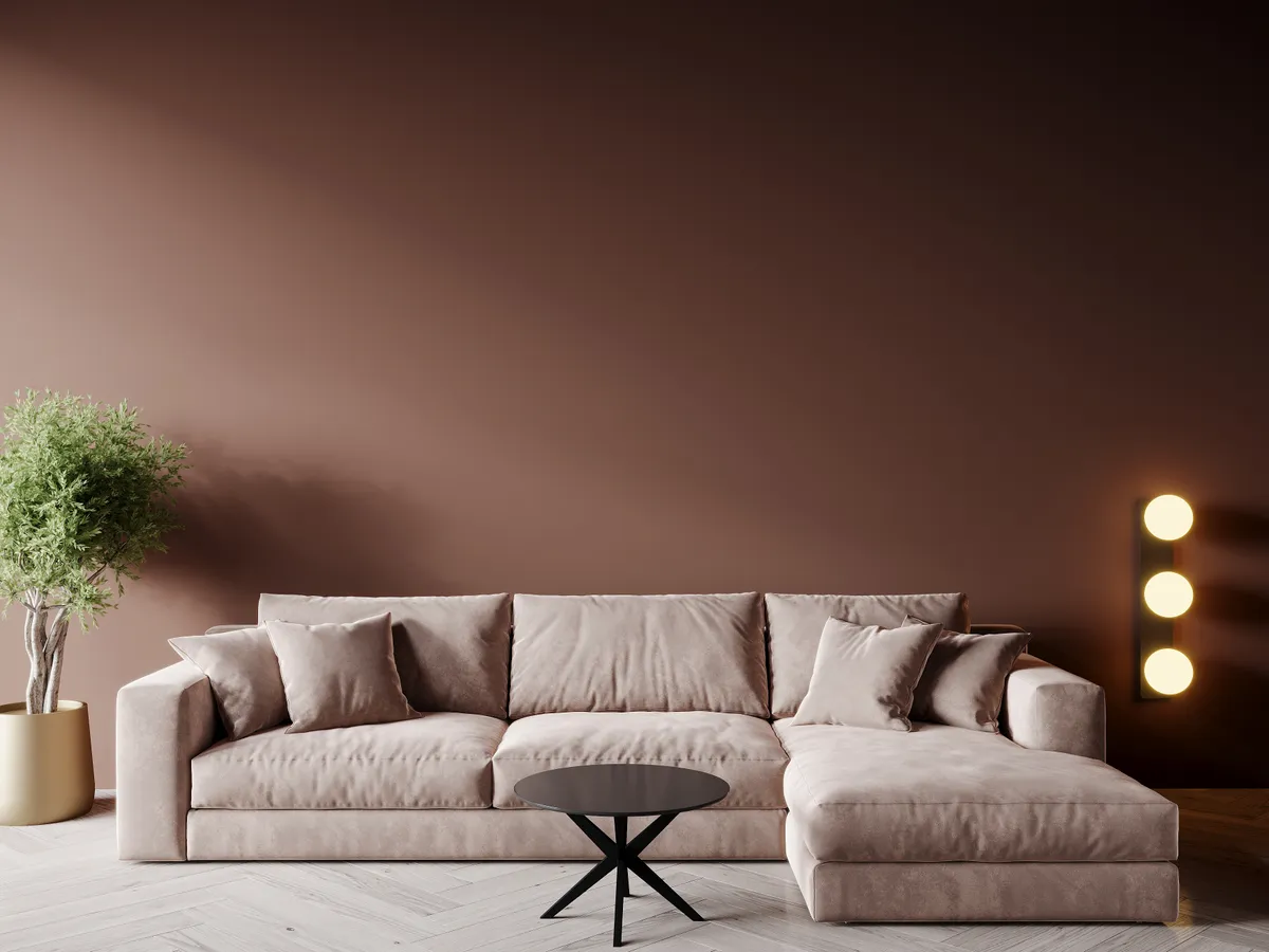 Modern living room with sofa in trend color of the year 2025 mocha mousse brown chocolate tone. Cozy interior design. 3d render
