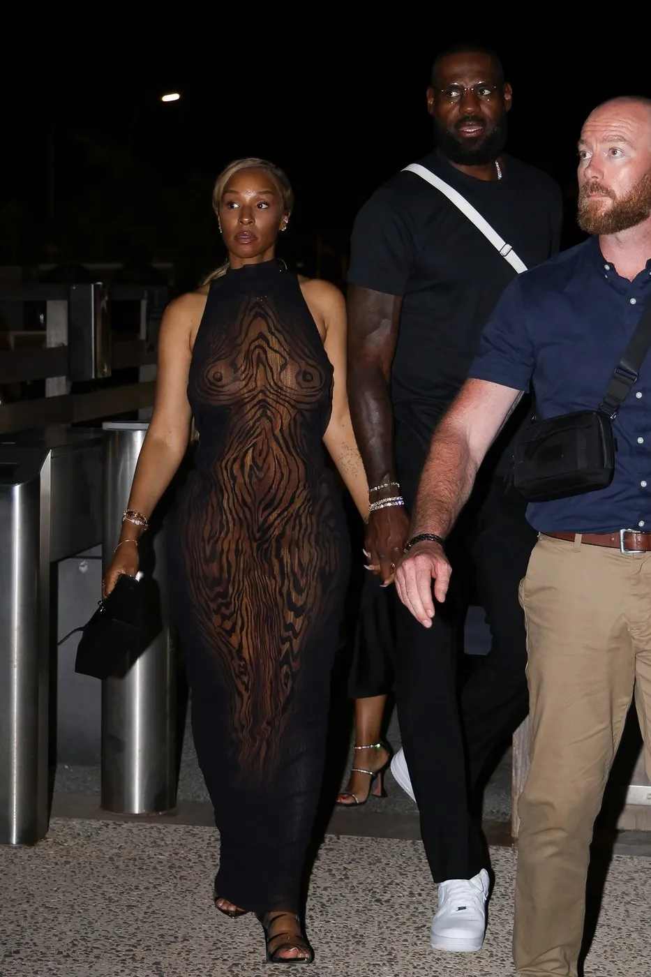 Saint Tropez, FRANCE LeBron James and his wife, Savannah, were spotted looking stylish in Saint-Tropez during a glamorous night out. Savannah made a bold fashion statement in a daring sheer dress, reminiscent of Lauren Sánchez’s headline-making look just a day earlier. LeBron kept it sleek in all black with white sneakers as the couple boarded a boat for the evening.
BACKGRID USA 24 JULY 2025,Image: 1025461529, License: Rights-managed, Restrictions: , Model Release: no, Pictured: LeBron James, Savannah James