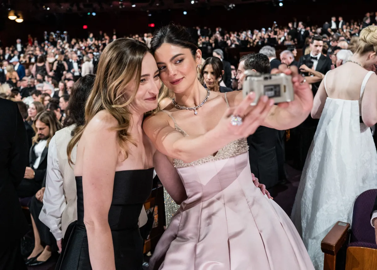 HOLLYWOOD, CALIFORNIA - MARCH 02: (EDITORIAL ONLY, NO BOOK COVERS) Monica Barbaro (R) attends the 97th Annual Oscars at Dolby Theatre on March 02, 2025 in Hollywood, California. (Photo by John Shearer/97th Oscars/The Academy via Getty Images)