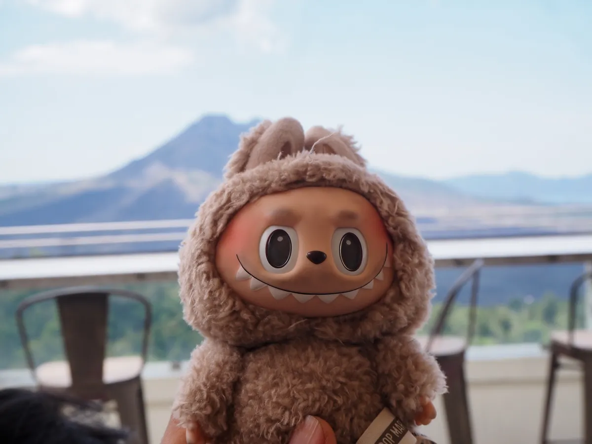 BALI - INDONESIA, 20-SEP-2024: Labubu doll with Mount Batur background in Bali