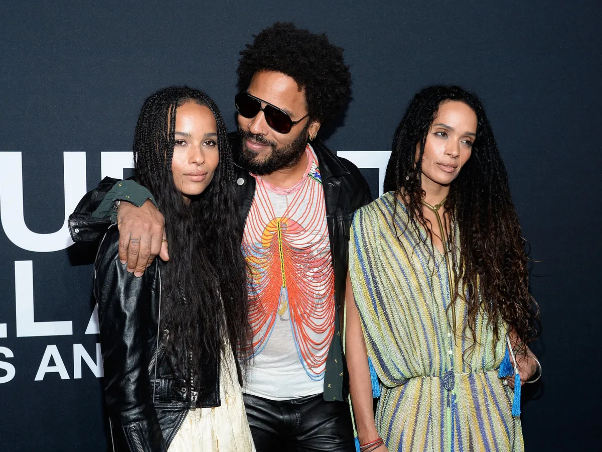 LOS ANGELES, CA - FEBRUARY 10: Musician Lenny Kravitz (center) and actresses Zoe Kravitz (L) and Lisa Bonet R) attend the Saint Laurent show at The Hollywood Palladium on February 10, 2016 in Los Angeles, California. (Photo by Kevork Djansezian/Getty Images)