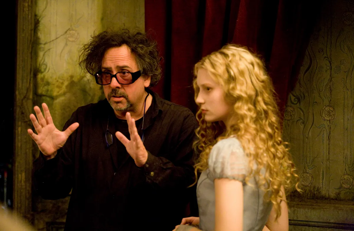 "ALICE IN WONDERLAND"(L-R) Tim Burton, Mia WasikowskaPh: Leah Gallo©Disney Enterprises, Inc. All Rights Reserved.,Image: 911352757, License: Rights-managed, Restrictions: , Model Release: no, Pictured: ALICE IN WONDERLAND