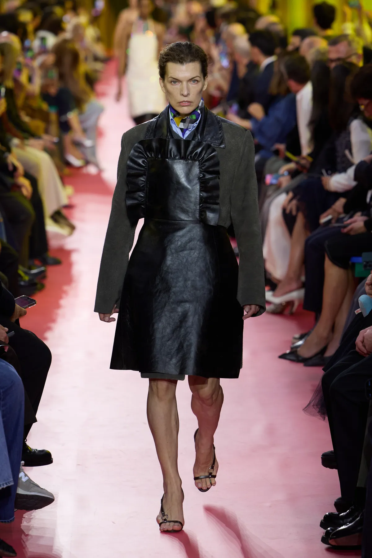 PARIS, FRANCE - OCTOBER 06: (EDITORIAL USE ONLY - For Non-Editorial use please seek approval from Fashion House) Milla Jovovich walks the runway during the Miu Miu Womenswear Spring/Summer 2026 show as part of Paris Fashion Week on October 06, 2025 in Paris, France. (Photo by Peter White/Getty Images)