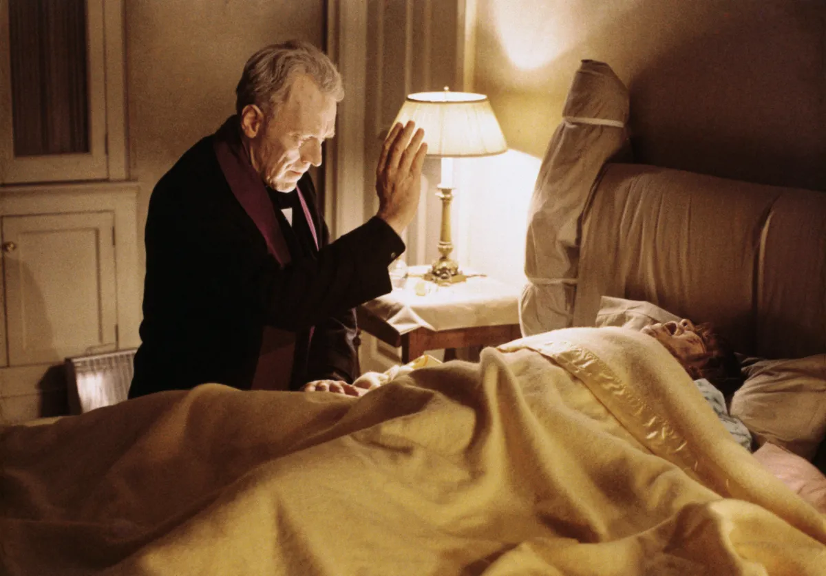 Swedish actor Max von Sydow performs a exorcism in a scene from the film The Exorcist. The little girl in the bed is actress Linda Blair.