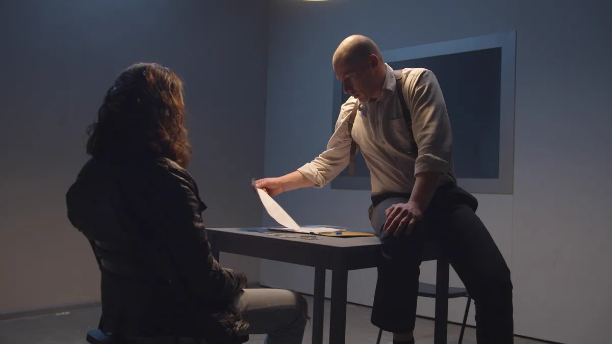 A detective shows a guy a photo of the victims of a maniac