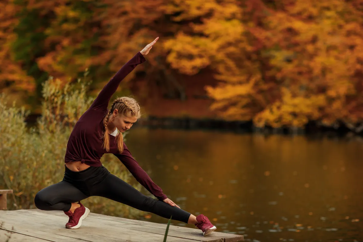A,Young,Beautiful,Woman,Is,Doing,Exercises,In,The,Autumn