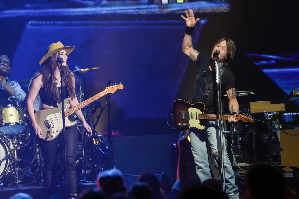 AUSTIN, TEXAS - MAY 04: Maggie Baugh and Keith Urban perform during the iHeartCountry Festival at the Moody Center on May 04, 2024 in Austin, Texas. (Photo by Amy E. Price/Getty Images)