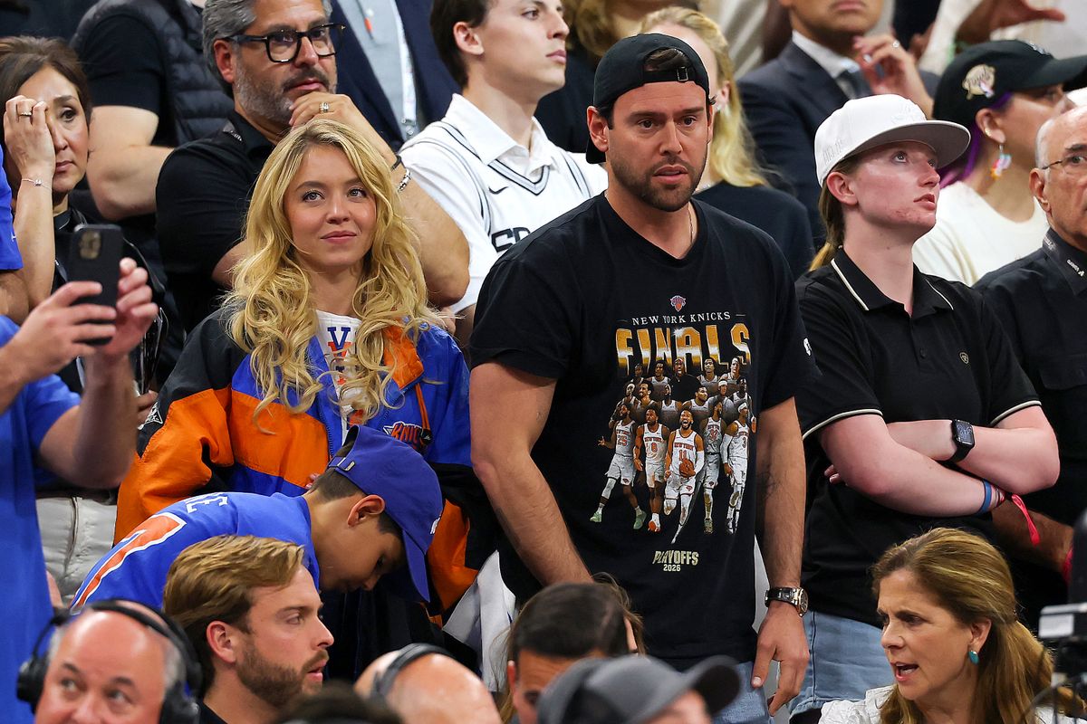 SAN ANTONIO, TEXAS - JUNE 13: Sydney Sweeney and Scooter Braun look on during the fourth quarter in Game Five of the 2026 NBA Finals between the San Antonio Spurs and the New York Knicks at Frost Bank Center on June 13, 2026 in San Antonio, Texas. NOTE TO USER: User expressly acknowledges and agrees that, by downloading and or using this photograph, User is consenting to the terms and conditions of the Getty Images License Agreement. Gregory Shamus/Getty Images/AFP (Photo by Gregory Shamus / GETTY IMAGES NORTH AMERICA / Getty Images via AFP)