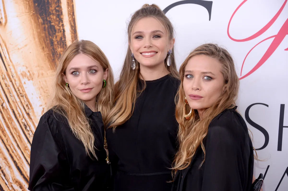 Elizabeth Olsen (center) and Mary-Kate and Ashley Olsen