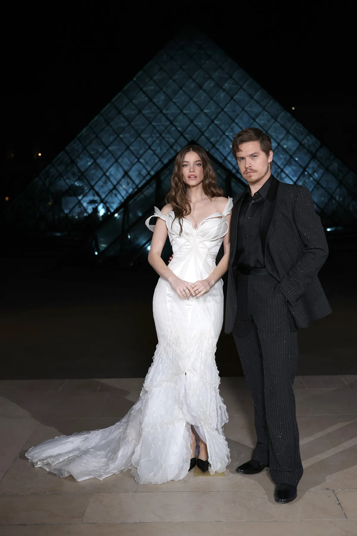 PARIS, FRANCE - MARCH 03: Barbara Sprouse and Dylan Sprouse attend the Grand Dîner du Louvre at Musee du Louvre on March 03, 2026 in Paris, France. The purpose of this annual evening is to raise funds, all of which will go towards measures to safeguard the Museum's heritage. (Photo by Aurore Marechal/Getty Images)
