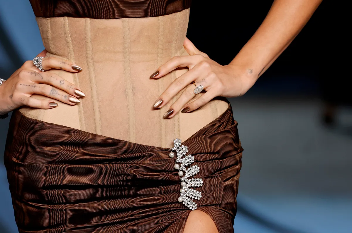 LOS ANGELES, CALIFORNIA - OCTOBER 18: Hailey Bieber, manicure, ring, and fashion detail, attends the 5th Annual Academy Museum Gala at the Academy Museum of Motion Pictures on October 18, 2025 in Los Angeles, California. (Photo by Frazer Harrison/WireImage)