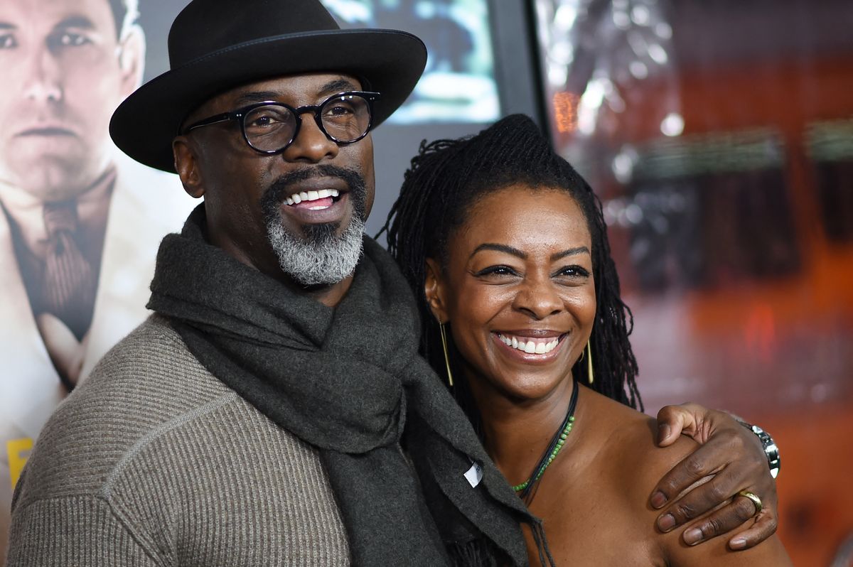 Actor Isaiah Washington and Jenisa Garland arrive for the world premiere of Warner Bros. "Live By Night," January 9, 2017 at the TCL Chinese Theater in Hollywood, California. (Photo by Robyn Beck / AFP)