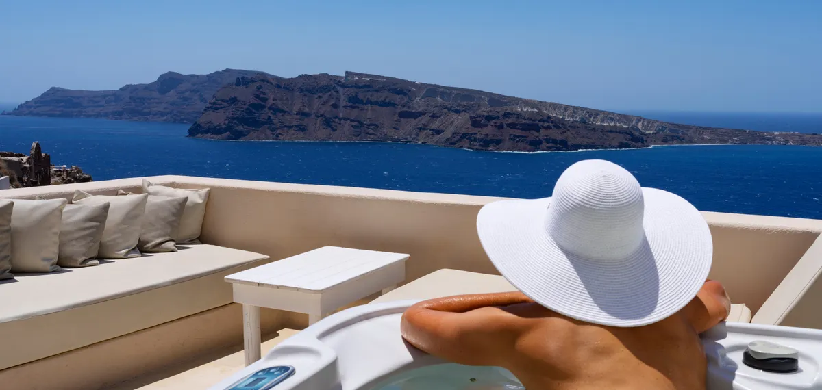 Woman in a bath at Oia, Santorini, Greece