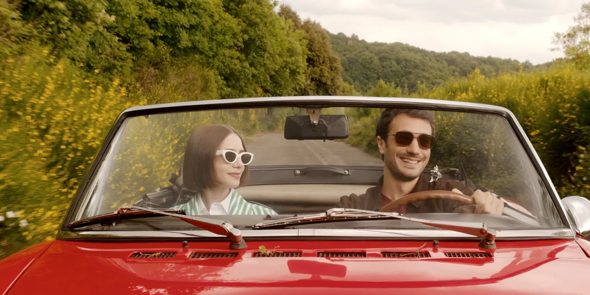 RELEASE DATE: December 18, 2025 TITLE: Emily in Paris, Season 5 STUDIO: Netflix DIRECTOR: Diego Borella PLOT: This season is a tale of two cities: Rome and Paris. Straddling both, Emily takes love and life to the next level. STARRING: (L to R) LILY COLLINS as Emily, EUGENIO FRANCESCHINI as Marcello.